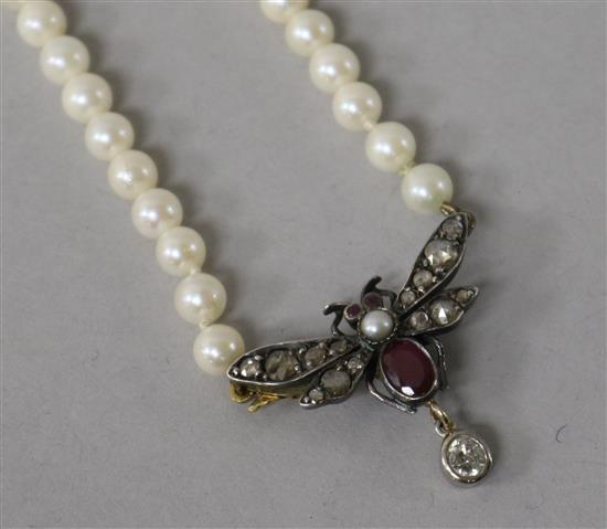A Victorian white and yellow metal, rose cut diamond, ruby and split pearl set bug pendant necklace.